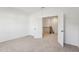 A spacious bedroom with plush carpeting and a view into the stairwell at 3297 Oakfields Rd # 1, New Hill, NC 27562