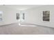 Bright bedroom with three windows and neutral carpet at 3297 Oakfields Rd # 1, New Hill, NC 27562