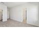 A bedroom featuring plush carpeting and multiple doorways at 3297 Oakfields Rd # 1, New Hill, NC 27562
