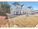 Stylish two-story home featuring a modern design, with attached garage and well-kept lawn at 3297 Oakfields Rd # 1, New Hill, NC 27562