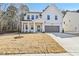 Charming two-story home featuring a modern design, well-manicured lawn, and attached garage at 3297 Oakfields Rd # 1, New Hill, NC 27562