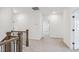 Hallway featuring carpet, white walls and dark wood banister at 3297 Oakfields Rd # 1, New Hill, NC 27562