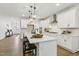 Open concept kitchen boasting a large center island with barstool seating and modern appliances at 3297 Oakfields Rd # 1, New Hill, NC 27562