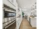 Modern kitchen with stainless steel oven, ample cabinet space, and an island view to the dining room at 3297 Oakfields Rd # 1, New Hill, NC 27562