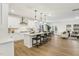 Well-lit, open-concept kitchen featuring a large center island with barstool seating at 3297 Oakfields Rd # 1, New Hill, NC 27562