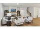Open living room featuring a fireplace, a TV, and staircase at 3297 Oakfields Rd # 1, New Hill, NC 27562
