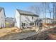 Rear exterior of gray two-story home with a screened porch and small windows at 3297 Oakfields Rd # 1, New Hill, NC 27562