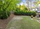 Large backyard with a privacy fence and plenty of green space for recreation and relaxation at 3316 Milton Rd, Raleigh, NC 27609