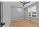 Comfortable bedroom with natural light, hardwood floors and neutral paint at 3316 Milton Rd, Raleigh, NC 27609