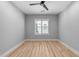 Bright and airy bedroom with wood floors and a large window offering natural light at 3316 Milton Rd, Raleigh, NC 27609
