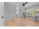 Large bedroom with desk area, ceiling fan, and hardwood floors at 3316 Milton Rd, Raleigh, NC 27609