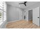 Bedroom with two entry doors and a view into the adjoining bathroom at 3316 Milton Rd, Raleigh, NC 27609