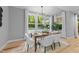 Bright dining room with large windows and a stylish chandelier at 3316 Milton Rd, Raleigh, NC 27609