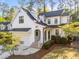 Charming two-story home featuring white siding, black trim, and a welcoming front porch at 3316 Milton Rd, Raleigh, NC 27609