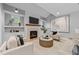 Cozy living room showcases a modern fireplace with a wooden mantel and comfortable seating at 3316 Milton Rd, Raleigh, NC 27609