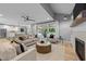 Open living room featuring a fireplace, comfortable seating, and sliding glass doors to the outdoor space at 3316 Milton Rd, Raleigh, NC 27609
