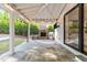 Outdoor patio with a brick fireplace, grill, and string lights, perfect for entertaining at 3316 Milton Rd, Raleigh, NC 27609