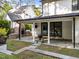 Covered patio boasts an outdoor kitchen with a stone fireplace and ample room for seating and grilling at 3316 Milton Rd, Raleigh, NC 27609