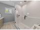 Modern bathroom featuring a glass-enclosed shower with tiled walls and a stylish fixture at 3316 Milton Rd, Raleigh, NC 27609