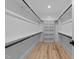 Spacious walk-in closet with custom shelving and hanging rods for optimal storage solutions at 3316 Milton Rd, Raleigh, NC 27609