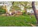 Lush backyard featuring mature trees, and a deck perfect for outdoor entertaining at 3517 Elk St, Burlington, NC 27215