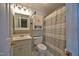 Bathroom with a pastel color scheme, sink, toilet, and shower with patterned shower curtain at 3517 Elk St, Burlington, NC 27215
