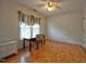 Bedroom with hardwood floors, a single window, and a simple desk and chair at 3517 Elk St, Burlington, NC 27215