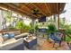 Relaxing covered deck with comfortable seating, ceiling fan, and decorative accents at 3517 Elk St, Burlington, NC 27215