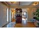 Inviting entryway featuring hardwood floors, a decorative hall tree, and views into other rooms at 3517 Elk St, Burlington, NC 27215