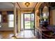 Elegant entryway with marble tile flooring, decorative lighting, and a glimpse of the front yard at 3517 Elk St, Burlington, NC 27215