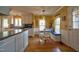 Bright kitchen with stainless steel appliances, white cabinets, and breakfast nook with built-in bench at 3517 Elk St, Burlington, NC 27215