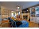 Inviting living room with a fireplace, ceiling fan, and comfortable seating area at 3517 Elk St, Burlington, NC 27215