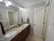 Bathroom features a double vanity with granite countertops, framed mirrors, and modern lighting at 4103 Cheek Point Pl, Burlington, NC 27215