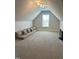 Versatile bonus room with neutral carpet, window, and floor cushions for seating or lounging at 4103 Cheek Point Pl, Burlington, NC 27215