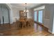 Formal dining room boasts hardwood floors, a chandelier, and French doors for a bright and inviting ambiance at 4103 Cheek Point Pl, Burlington, NC 27215