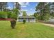 Charming single story home with a covered front porch and a large grassy front yard at 423 Orange Heights Rd, Hillsborough, NC 27278