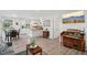 Inviting living room with ample natural light, open floorplan, and hardwood flooring at 423 Orange Heights Rd, Hillsborough, NC 27278