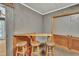 Cozy bar area complete with wooden bar and stools at 480 Big Branch Dr, Pittsboro, NC 27312