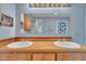 Close up of bathroom vanity with double sinks and wood countertop at 480 Big Branch Dr, Pittsboro, NC 27312
