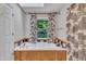 Bathtub with patterned shower curtain and a view of the outdoors at 480 Big Branch Dr, Pittsboro, NC 27312