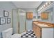 Traditional bathroom with a glass-enclosed shower and double sink vanity at 480 Big Branch Dr, Pittsboro, NC 27312