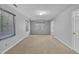 Bright and spacious bedroom with neutral carpet, two windows, and a comfortable atmosphere for relaxation at 480 Big Branch Dr, Pittsboro, NC 27312