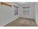 Neutral bedroom with carpet flooring and two windows, offering a simple and comfortable living space at 480 Big Branch Dr, Pittsboro, NC 27312