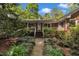 Attractive brick-front home with a charming porch and well-maintained landscaping at 480 Big Branch Dr, Pittsboro, NC 27312