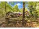 Charming brick home with well-maintained landscaping and a quaint wooden fence, exuding curb appeal at 480 Big Branch Dr, Pittsboro, NC 27312