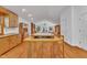 Spacious kitchen features wood cabinets, a central island with cooktop, and hardwood floors, creating a warm and inviting space at 480 Big Branch Dr, Pittsboro, NC 27312