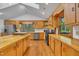 Bright kitchen with wood cabinets, stainless steel appliances, and ample counter space for cooking and meal preparation at 480 Big Branch Dr, Pittsboro, NC 27312