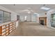 Spacious living room with high ceilings, skylights, fireplace, and access to a deck via a sliding glass door at 480 Big Branch Dr, Pittsboro, NC 27312