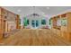 Expansive living room with brick fireplace, hardwood floors, built-in shelving, and natural light creating an inviting atmosphere at 480 Big Branch Dr, Pittsboro, NC 27312