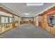 Spacious living area with hardwood trim, a bar with stools, and a view into an adjacent room at 480 Big Branch Dr, Pittsboro, NC 27312